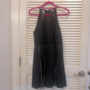 BCBG MAXAZRIA halter black dress with mesh paneling. Size 6.